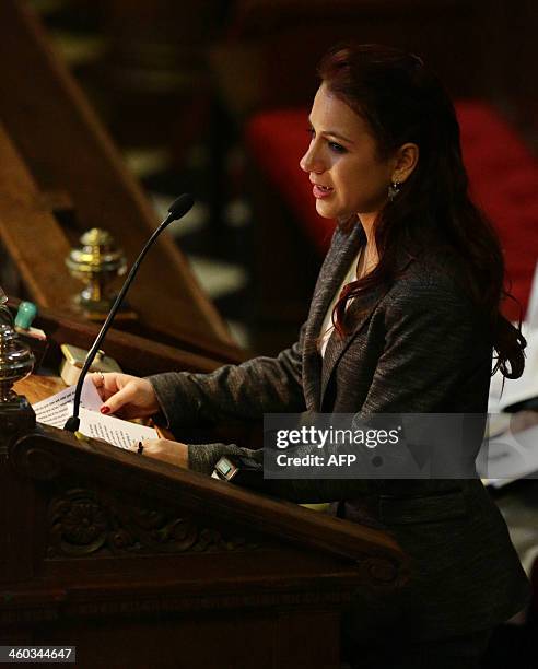 Ingrid Biggs, granddaughter of Great Train Robber Ronnie Biggs speaks during his funeral at Golders Green crematorium in north London on January 3,...