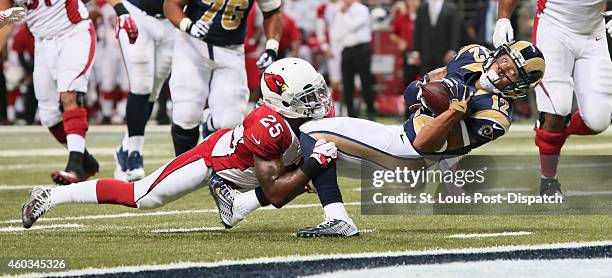 St. Louis Rams wide receiver Stedman Bailey stretches towards the end zone as he is tackled at the 1-yard line by Arizona Cardinals cornerback...