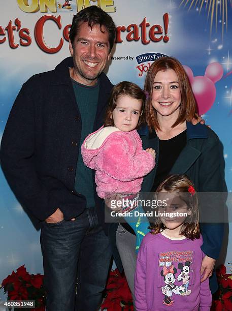 Actors Alexis Denisof and Alyson Hannigan and children Keeva Jane Denisof and Satyana Marie Denisof attend Disney On Ice presents Let's Celebrate! at...
