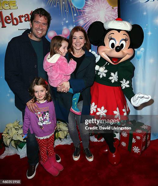 Actors Alexis Denisof and Alyson Hannigan and children Keeva Jane Denisof and Satyana Marie Denisof attend Disney On Ice presents Let's Celebrate! at...