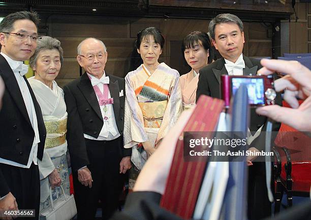 Professor Isamu Akasaki and his family members pose for photographs after the Nobel Prize Award Ceremony 2014 at Concert Hall on December 10, 2014 in...