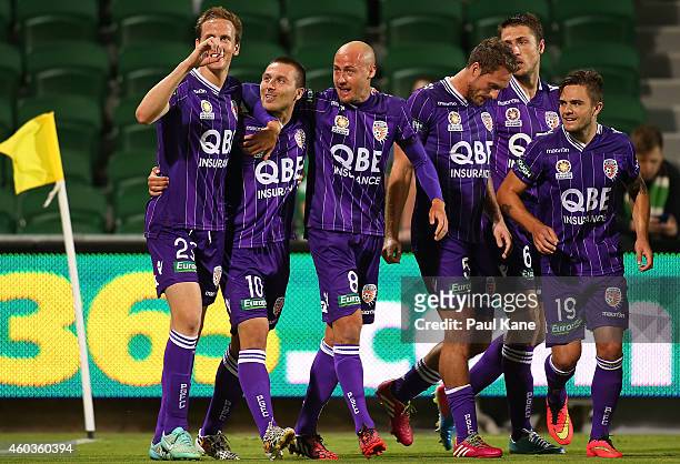 Nebojsa Marinkovic of the Glory is congratulated by Michael Thwaite and Ruben Zadkovich after scoring a goal during the round 11 A-League match...