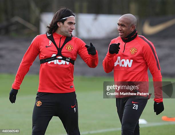 Radamel Falcao and Anderson of Manchester United chat during a first team training session at Aon Training Complex on December 11, 2014 in...