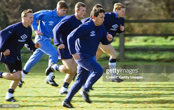 England manager Graham Taylor leads his players on a run Lee Dixon, Gary Pallister, Alan Shearer and Stuart Pearce, during a training session circa...