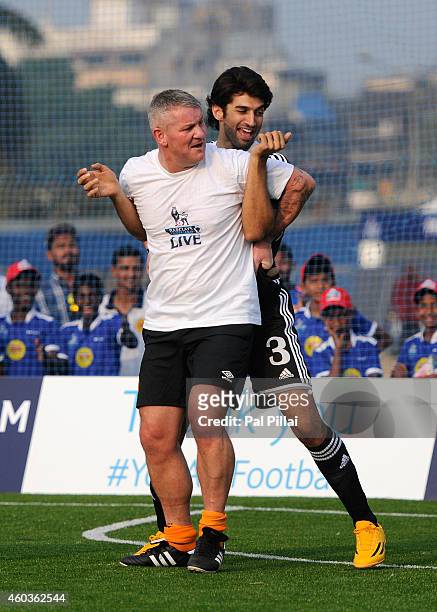 Bollywood actor Aditya roy Kapoor jokes with Dean Windass, Hull city Legend in action during an exhibition match played between BPL legends and All...