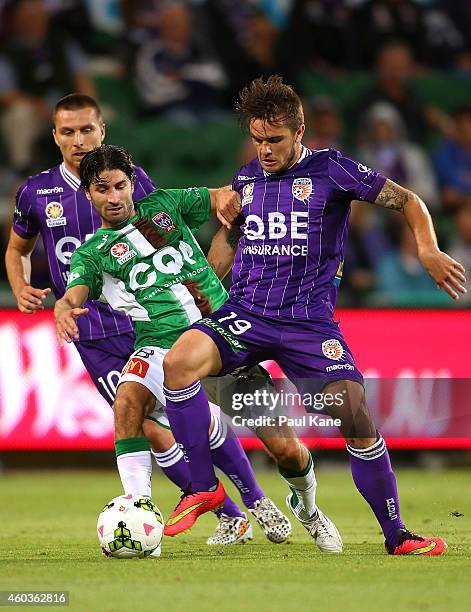 Zenon Caravella of the Jets and Josh Risdon of the Glory contest for the ball during the round 11 A-League match between Perth Glory and Newcastle...