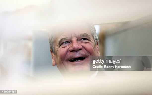 German President Joachim Gauck smiles during a meeting with young refugees at a training center on December 12, 2014 in Magdeburg, Germany. The...