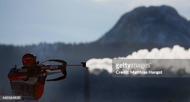 Evgeniy Garanichev of Russia in front of a smoking chimney at the zeoring for the men's 10 km sprint event during the IBU Biathlon World Cup on...