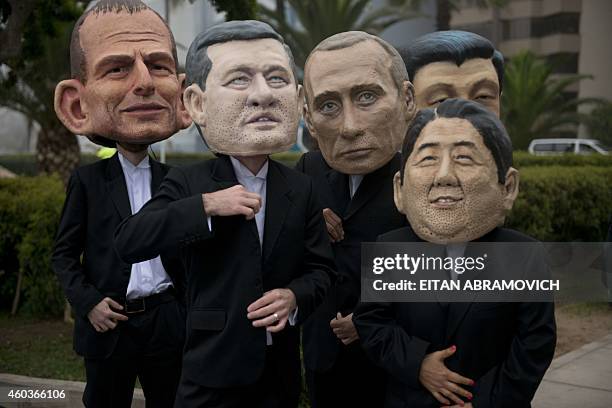 Activist depicting Australia's Prime Minister Tony Abbot , China's President Xi Jinping , Canada's Prime Minister Stephen Harper , Rusia's President...