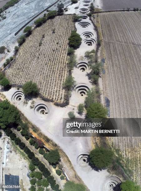 Aerial photo showing the ventilation holes of the Cantalloc Aqueduct in Nazca, Peru, some 435 kms south of Lima on December 12, 2014. These aqueducts...
