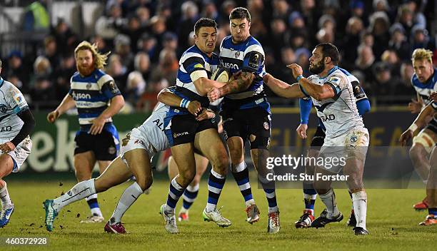 Bath wing Matt Banahan and Sam Burgess charge through the Montpellier centre during the European Rugby Champions Cup pool match between Bath Rugby...