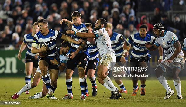 Bath wing Matt Banahan and Sam Burgess charge through the Montpellier centre during the European Rugby Champions Cup pool match between Bath Rugby...