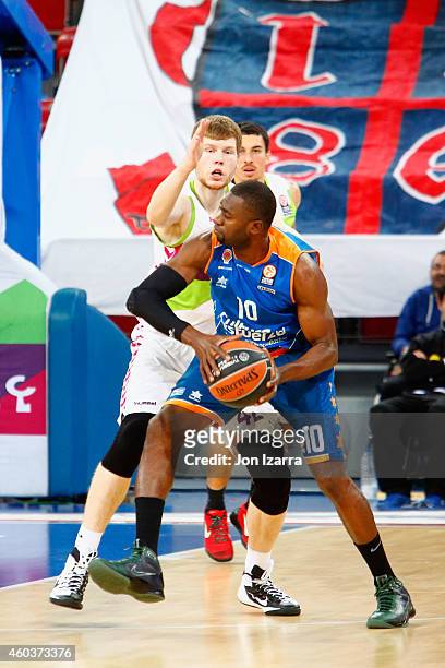 Romain Sato, #10 of Valencia Basket competes with Davis Bertans, #42 of Laboral Kutxa Vitoria during the 2014-2015 Turkish Airlines Euroleague...