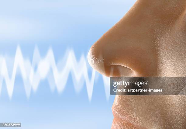 a smell moving towards a human nose - nose stock pictures, royalty-free photos & images