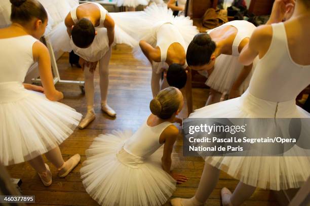 National Opera ballet school pupils prepare in the make-up room prior to the annual "Defile" performances at Opera Garnier on September 21, 2012 in...