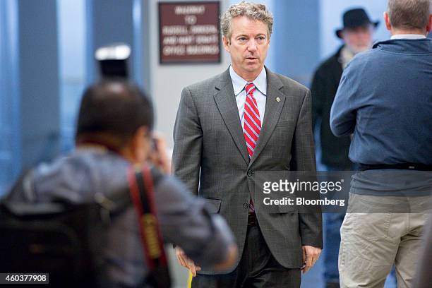 Senator Rand Paul, a Republican from Kentucky, walks through the the U.S. Capitol basement in Washington, D.C., U.S., on Friday, Dec. 12, 2014. The...