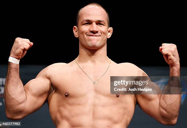 Former UFC heavyweight champion Junior Dos Santos of Brazil poses on the scale during the UFC Fight Night weigh-in event at the Phoenix Convention...