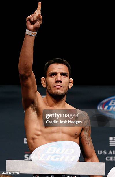 Rafael dos Anjos of Brazil poses on the scale after weighing in during the UFC Fight Night weigh-in event at the Phoenix Convention Center on...