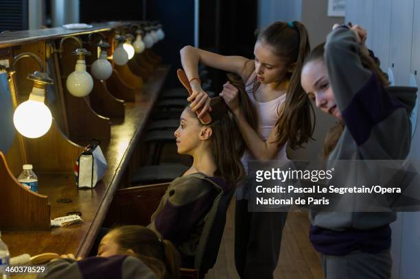 Pupils of the National Opera Ballet School prepare backstage before a rehersal for Gala Noureev Performance on March 4, 2013 at Opera Garnier in...