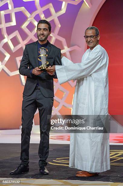 Essam Doukhou awarded Cinecoles Award by Abderrahmane Sissako during the 14th Marrakech International Film Festival on December 12, 2014 in...