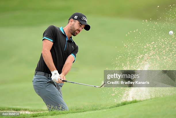 Nick Cullen of Australia plays a shot out of the bunker on the 3rd hole during day three of the 2014 Australian PGA Championship at Royal Pines...
