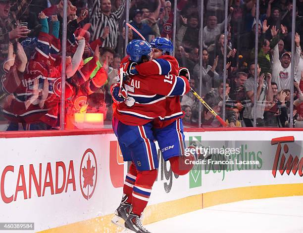 David Desharnais of the Montreal Canadiens celebrates with Pierre-Alexandre Parenteau after scoring a goal against the Los Angeles Kings in the NHL...