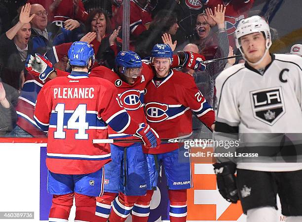 Jiri Sekac of the Montreal Canadiens celebrates with P.K. Subban and Tomas Plekanec after scoring a goal against the Los Angeles Kings in the NHL...