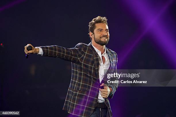 Spanish singer David Bisbal performs on stage during the "40 Principales" awards 2013 ceremony at the Barclaycard Center on December 12, 2014 in...