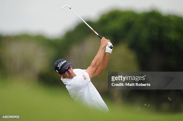 Adam Scott of Australia hits his approach shot on the 7th hole during day three of the 2014 Australian PGA Championship at Royal Pines Resort on...