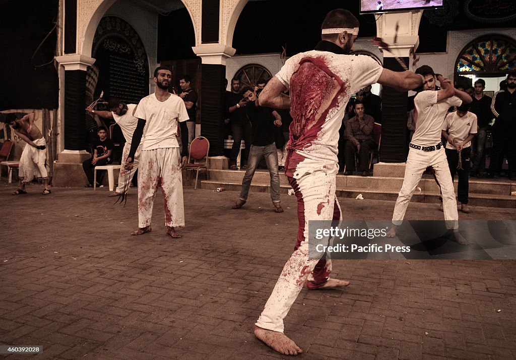 Male Shia Muslims take part in ceremonial chest beating...