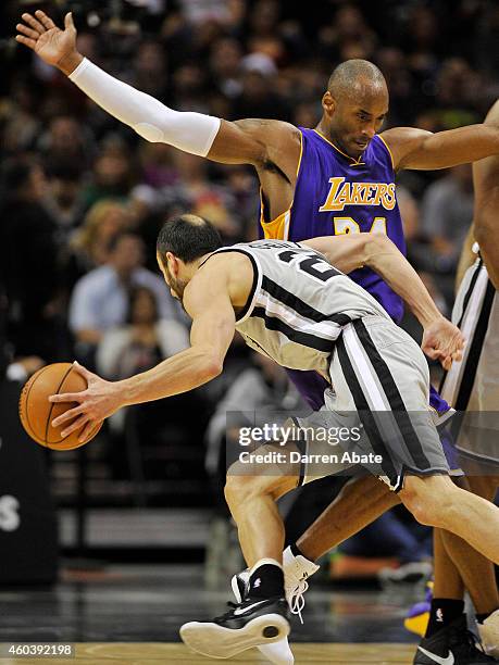 Guard Kobe Bryant, right, of the Los Angeles Lakers defends guard Manu Ginobili of the San Antonio Spurs during the first half of an NBA basketball...