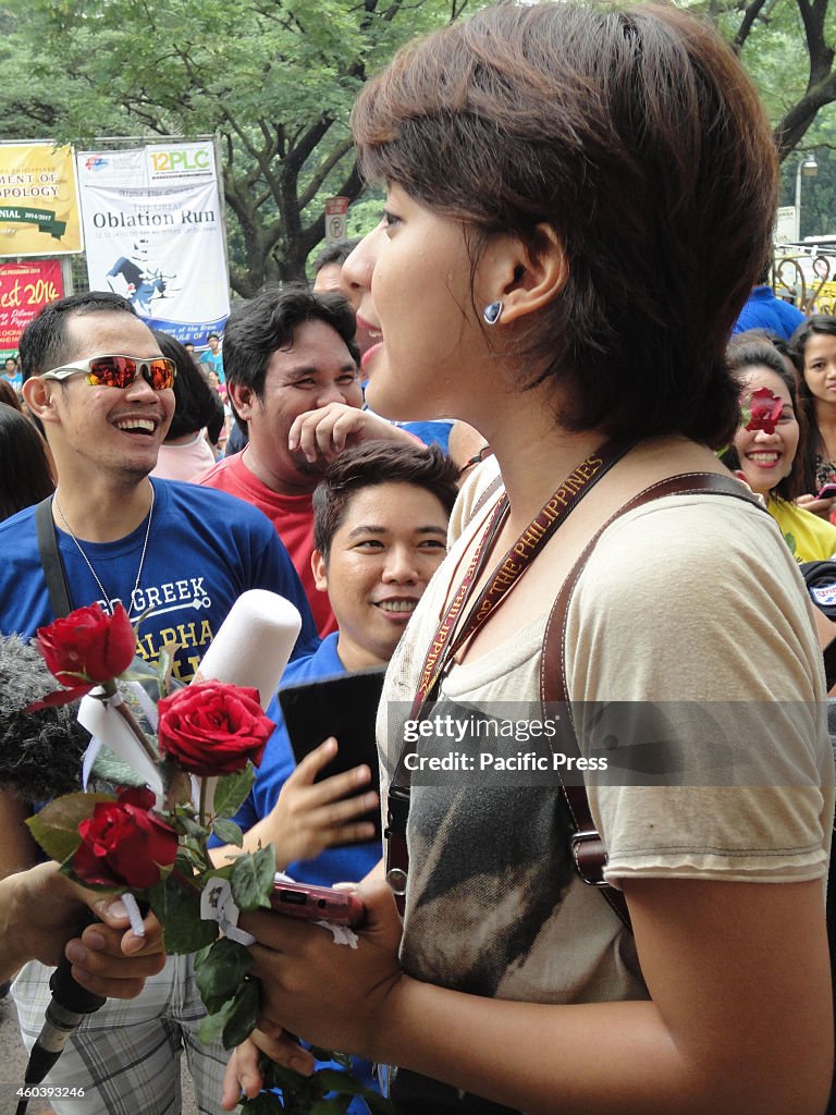 Filipina student Katrina Tapia gives an interview to the...