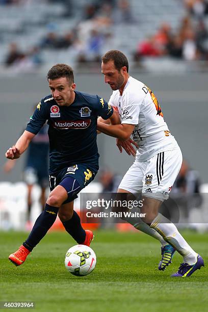 Richard Vernes of the Mariners is tackled by Andrew Durante of the Phoenix during the round 11 A-League match between the Wellington Phoenix and the...