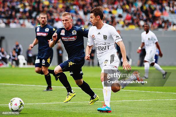 Jacob Poscoliero of the Mariners defends against Nathan Burns of the Phoenix during the round 11 A-League match between Wellington Phoenix and...