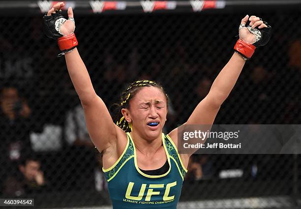 Carla Esparza reacts after submitting Rose Namajunas in their strawweight championship fight during The Ultimate Fighter Finale event inside the...