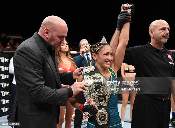 President Dana White presents Carla Esparza with the strawweight championship belt after submitting Rose Namajunas in the third round during The...