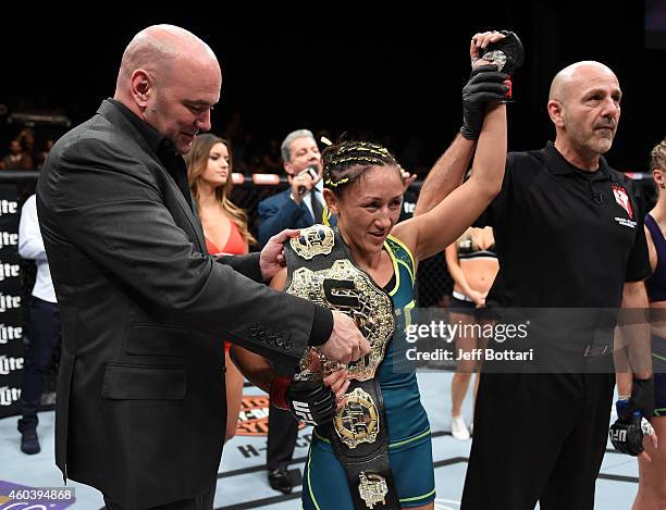 President Dana White presents Carla Esparza with the strawweight championship belt after submitting Rose Namajunas in the third round during The...