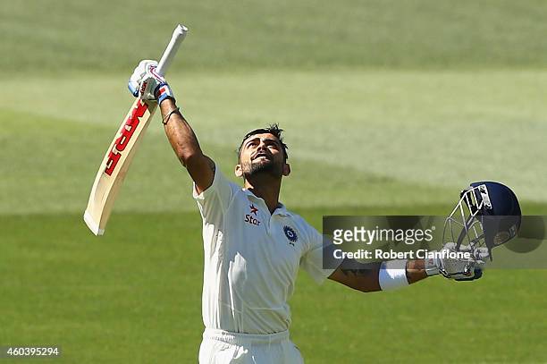 Virat Kohli of India celebrates after reaching his century during day five of the First Test match between Australia and India at Adelaide Oval on...