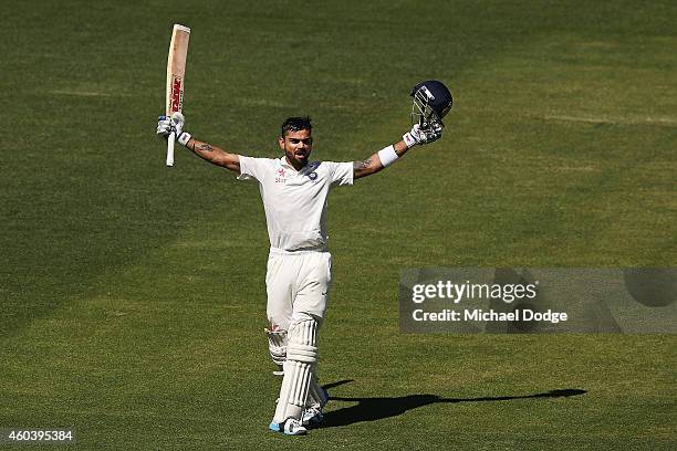 Virat Kohli of India celebrates his century during day five of the First Test match between Australia and India at Adelaide Oval on December 13, 2014...