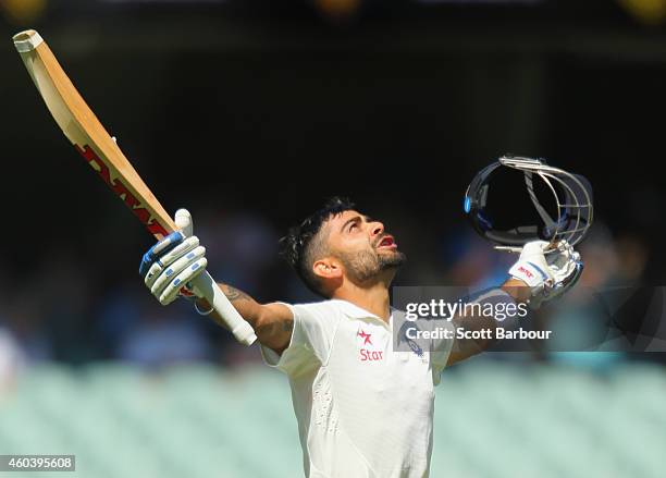 Virat Kohli of India celebrates as he reaches his century during day five of the First Test match between Australia and India at the Adelaide Oval on...