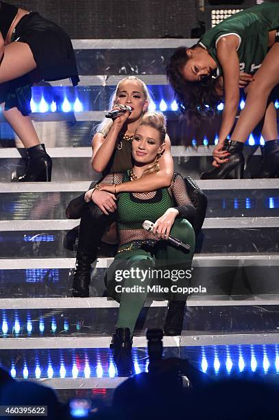 Rita Ora and Iggy Azalea perform onstage during iHeartRadio Jingle Ball 2014, hosted by Z100 New York and presented by Goldfish Puffs at Madison...