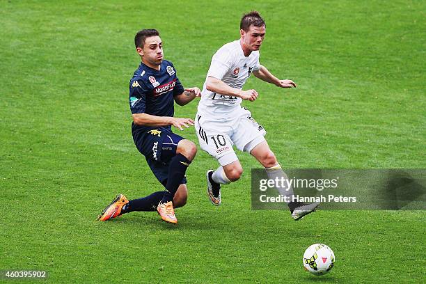 Anthony Caceres of the Mariners tackles Michael McGlinchey of the Phoenix during the round 11 A-League match between Wellington Phoenix and Central...