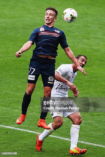 Richard Vernes of the Mariners competes in the air with Emmanuel Muscat of the Phoenix for the ball during the round 11 A-League match between...