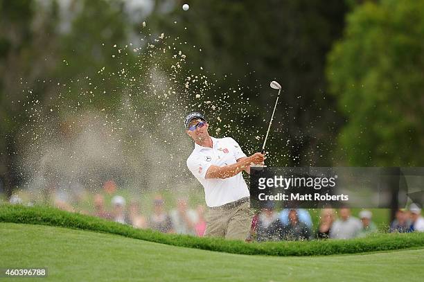 Adam Scott of Australia hits out of the bunker on the 3rd hole during day three of the 2014 Australian PGA Championship at Royal Pines Resort on...