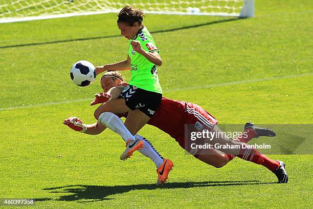 Brianna Davey of the Victory makes a save as Ashleigh Sykes of United takes a shot on goal during the W-League Semi Final match between Melbourne...