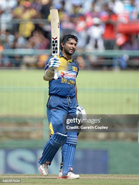 Kumar Sangakkara of Sri Lanka celebrates reaching his century during the 6th One Day International match between Sri Lanka and England at Pallekele...