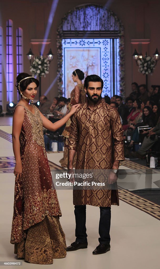 Pakistani model presents creations by Pakistani designers...