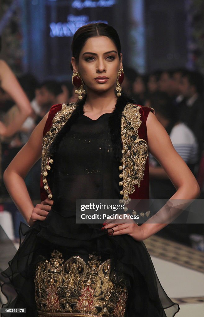 Pakistani model presents creations by Pakistani designers...