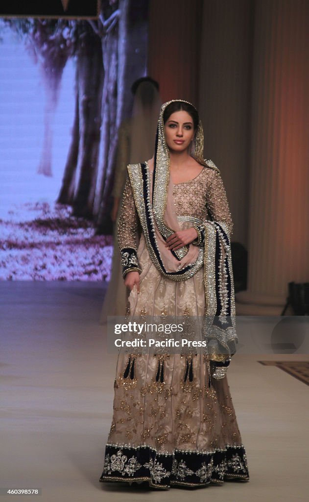 Pakistani model presents creations by Pakistani designers...