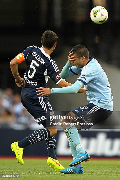 Mark Milligan of Victory and Terry Antonis of Sydney collide during the round 11 A-League match between Melbourne Victory and Sydney FC at Etihad...